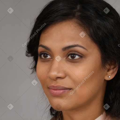 Joyful latino young-adult female with long  brown hair and brown eyes