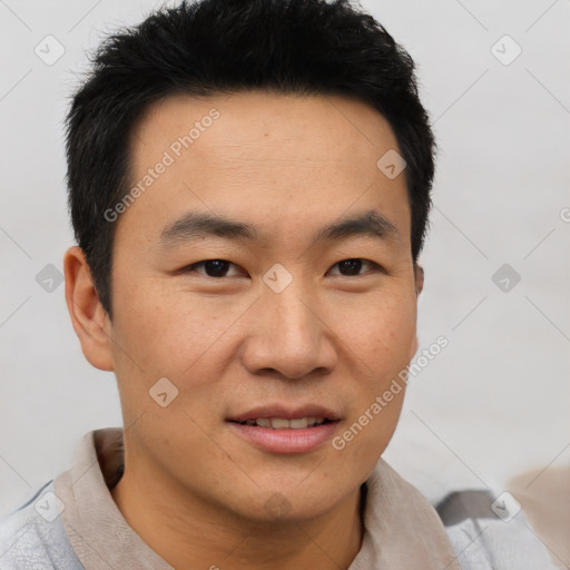 Joyful asian young-adult male with short  brown hair and brown eyes