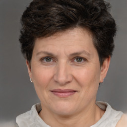 Joyful white adult female with short  brown hair and brown eyes