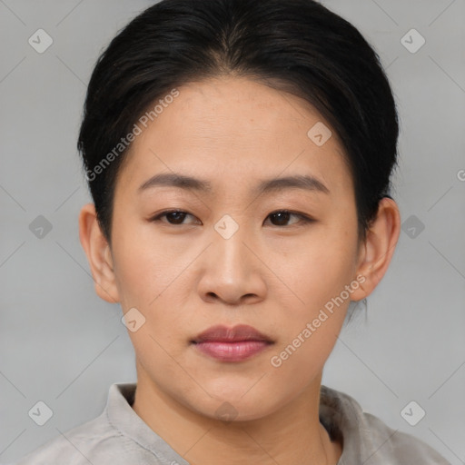 Joyful asian young-adult female with short  brown hair and brown eyes