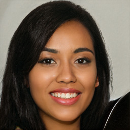 Joyful latino young-adult female with long  black hair and brown eyes