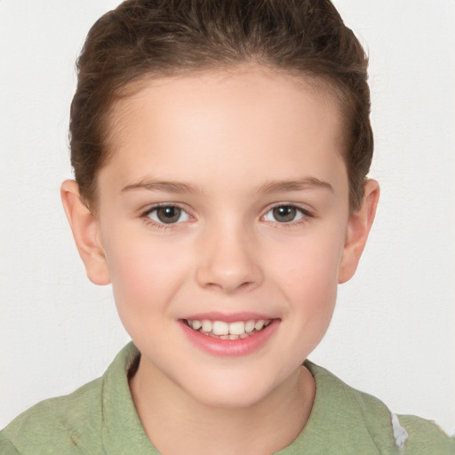 Joyful white child female with short  brown hair and brown eyes