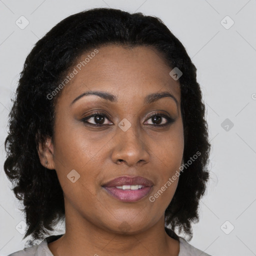 Joyful black young-adult female with medium  brown hair and brown eyes