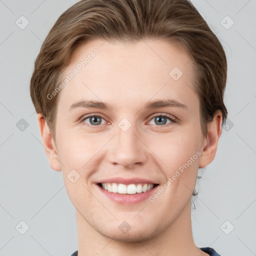 Joyful white young-adult female with short  brown hair and grey eyes