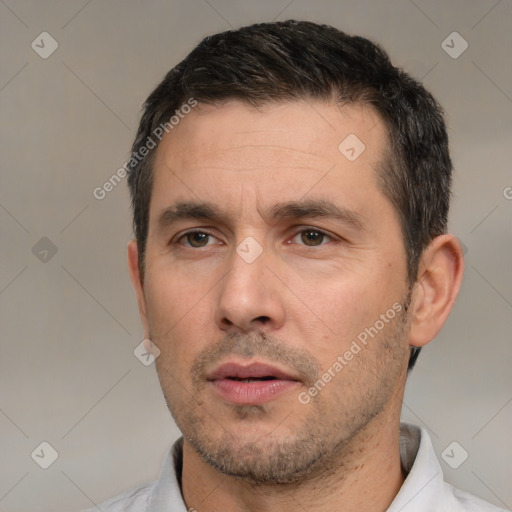 Neutral white adult male with short  black hair and brown eyes