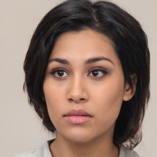 Neutral asian young-adult female with medium  black hair and brown eyes