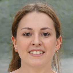 Joyful white young-adult female with medium  brown hair and brown eyes