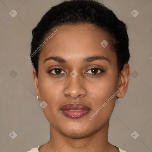 Joyful black young-adult female with short  black hair and brown eyes