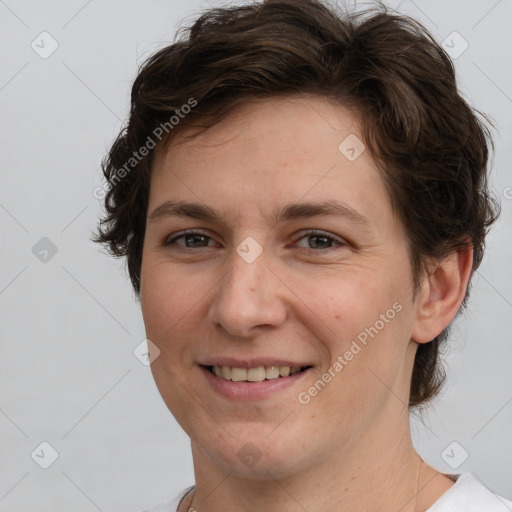 Joyful white adult female with short  brown hair and brown eyes