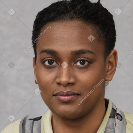 Joyful black young-adult female with short  black hair and brown eyes