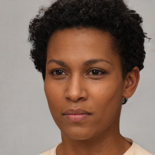 Neutral black young-adult female with short  brown hair and brown eyes