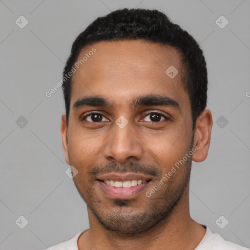 Joyful black young-adult male with short  black hair and brown eyes