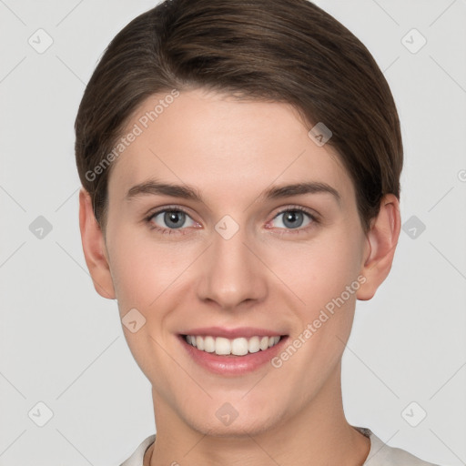 Joyful white young-adult female with short  brown hair and grey eyes