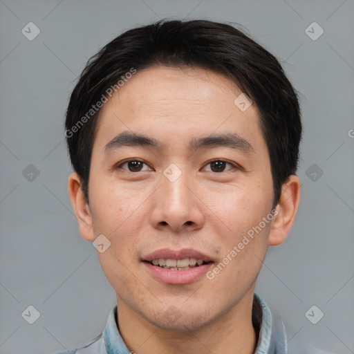 Joyful asian young-adult male with short  brown hair and brown eyes