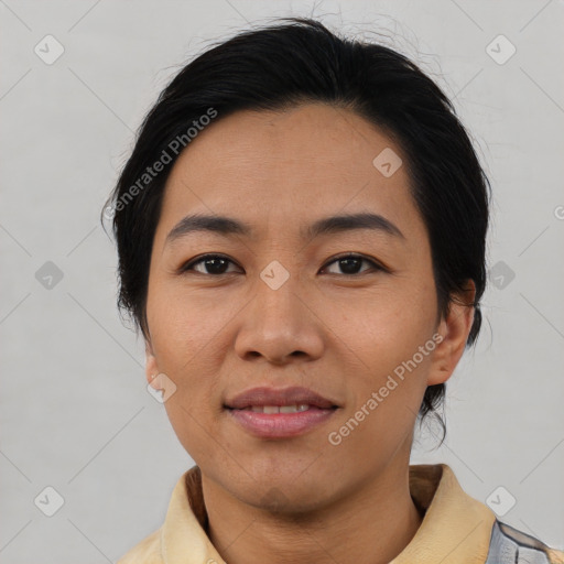 Joyful asian young-adult female with medium  black hair and brown eyes