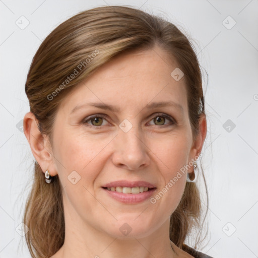 Joyful white adult female with medium  brown hair and grey eyes