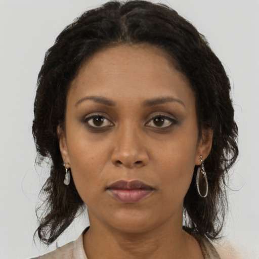 Neutral black young-adult female with medium  brown hair and brown eyes