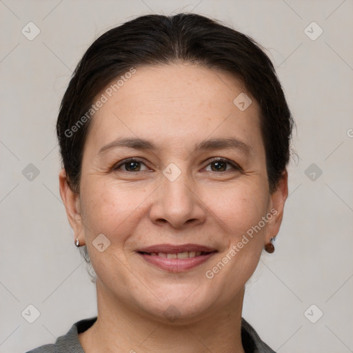 Joyful white adult female with short  brown hair and brown eyes