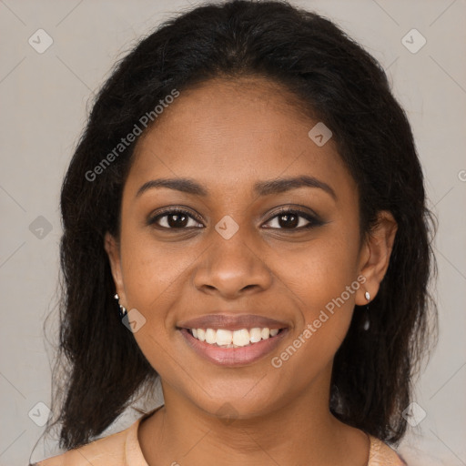 Joyful black young-adult female with medium  brown hair and brown eyes