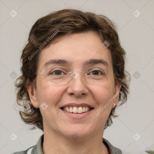 Joyful white adult female with medium  brown hair and green eyes