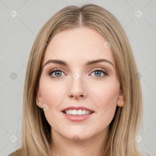 Joyful white young-adult female with long  brown hair and grey eyes