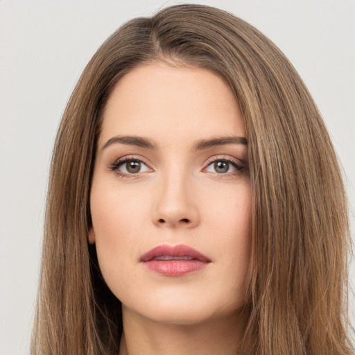 Neutral white young-adult female with long  brown hair and brown eyes