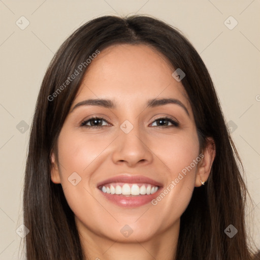 Joyful white young-adult female with long  brown hair and brown eyes