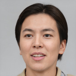 Joyful asian young-adult male with short  brown hair and brown eyes