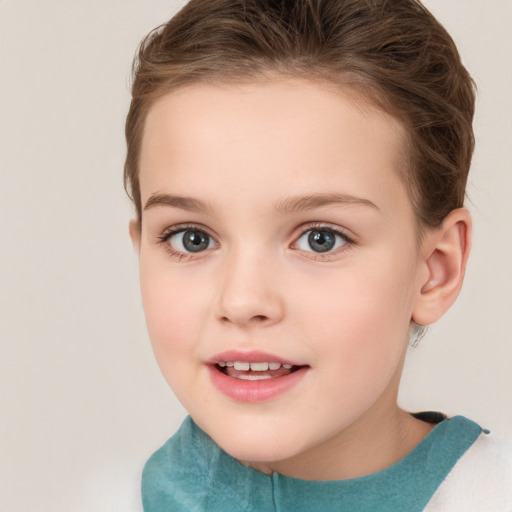 Joyful white child female with short  brown hair and brown eyes