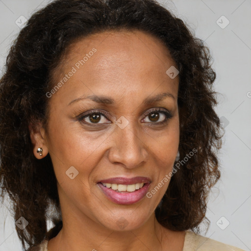 Joyful black adult female with medium  brown hair and brown eyes