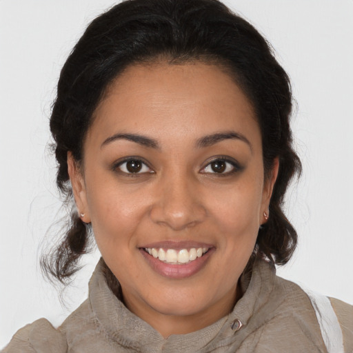 Joyful latino young-adult female with medium  brown hair and brown eyes