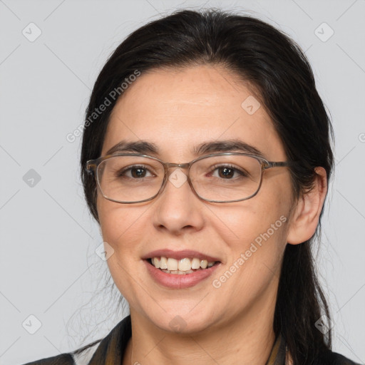 Joyful white adult female with medium  brown hair and brown eyes