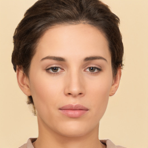 Neutral white young-adult female with short  brown hair and brown eyes