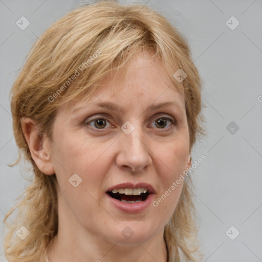 Joyful white adult female with medium  brown hair and blue eyes