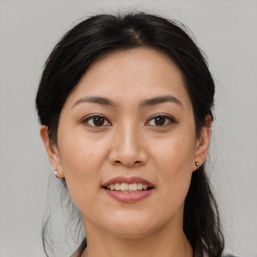Joyful white young-adult female with medium  brown hair and brown eyes