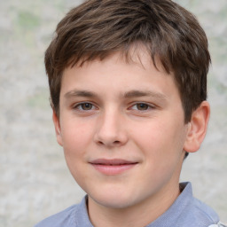 Joyful white child male with short  brown hair and brown eyes