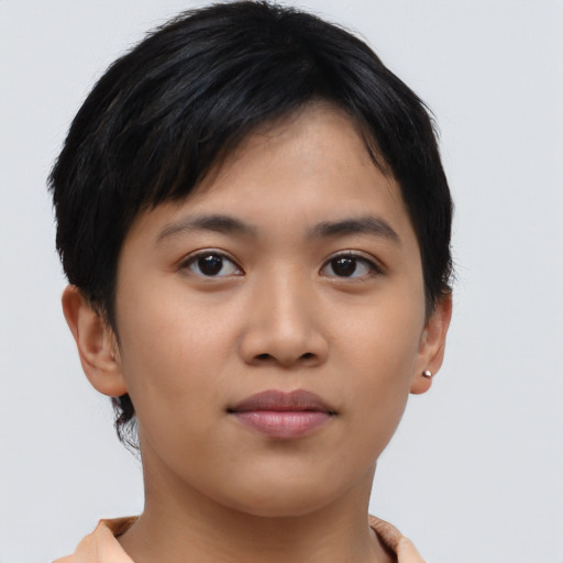 Joyful asian young-adult female with short  brown hair and brown eyes