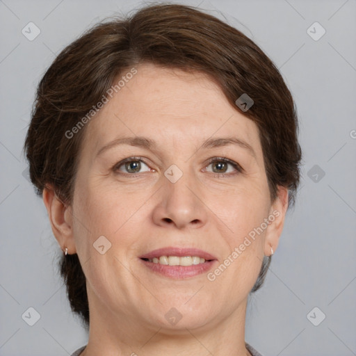 Joyful white adult female with medium  brown hair and grey eyes