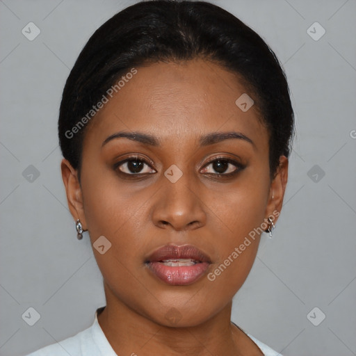 Joyful black young-adult female with short  black hair and brown eyes