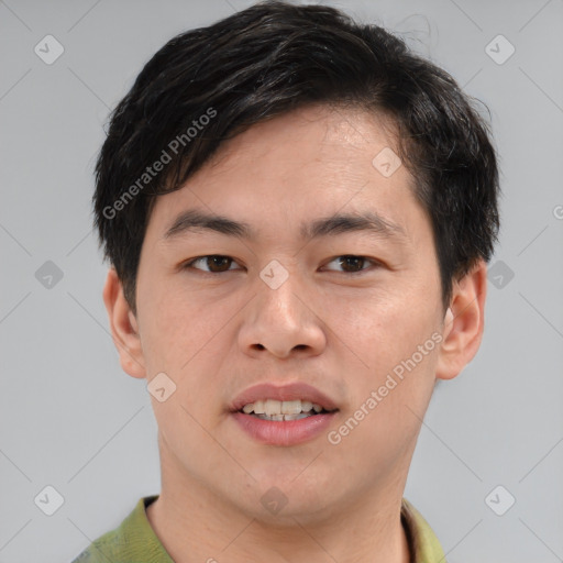 Joyful asian young-adult male with short  brown hair and brown eyes