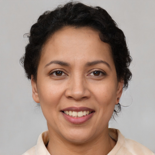 Joyful white adult female with short  brown hair and brown eyes