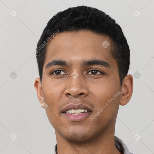 Joyful latino young-adult male with short  black hair and brown eyes