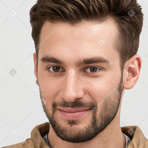 Joyful white young-adult male with short  brown hair and brown eyes