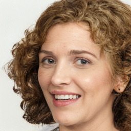 Joyful white young-adult female with medium  brown hair and green eyes