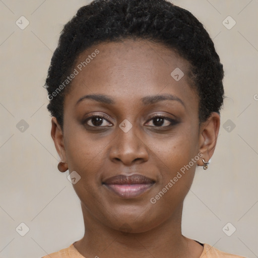 Joyful black young-adult female with short  brown hair and brown eyes