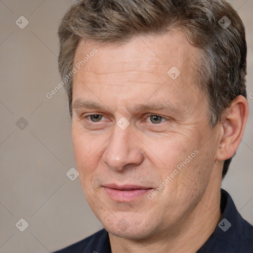 Joyful white middle-aged male with short  brown hair and brown eyes