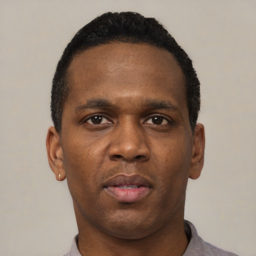 Neutral black young-adult male with short  black hair and brown eyes