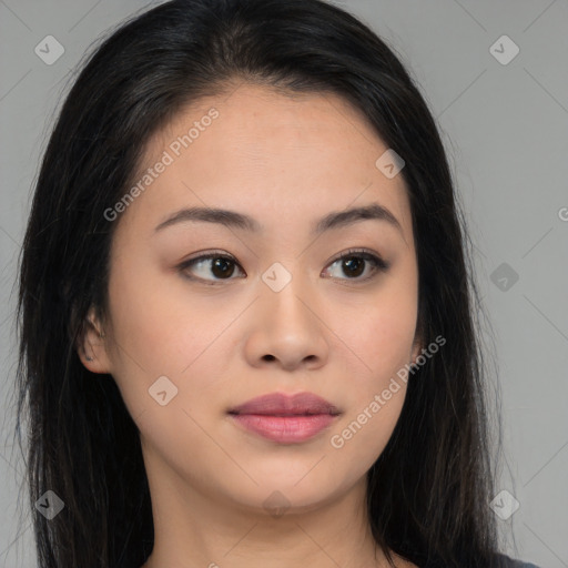 Joyful asian young-adult female with long  brown hair and brown eyes