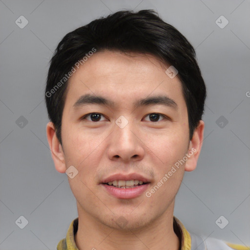 Joyful asian young-adult male with short  black hair and brown eyes