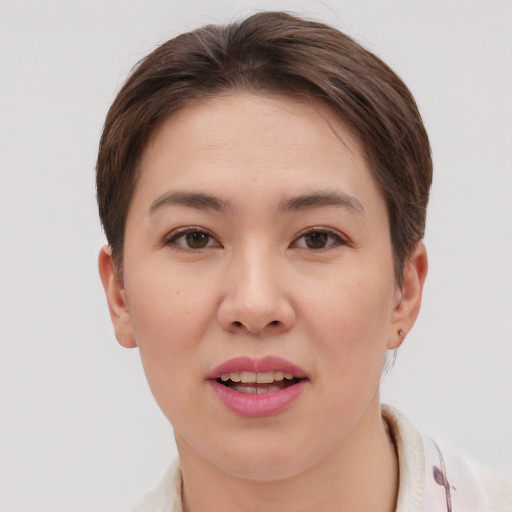Joyful white young-adult female with short  brown hair and brown eyes